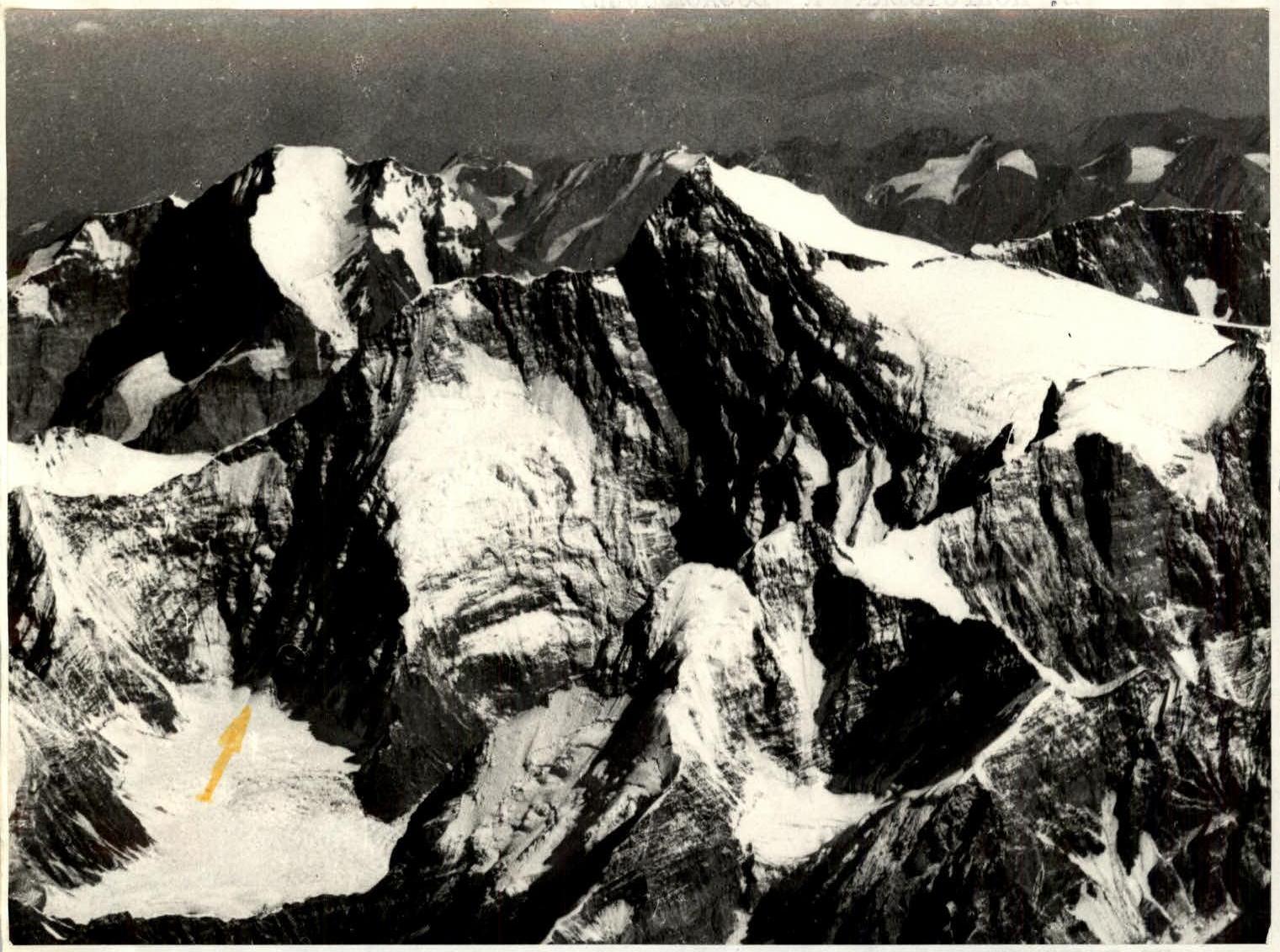 img":{"width":1651,"height":2333,"format":"Jpeg","uri":"https://summitx.info/media/1/Ezf4ldEkM1cT3xuCC3HlsyP1ff4MO74N/img-1.jpeg","id":64763457↗})
2. Ascent Preparation
Preparation for the ascent began in the fall of 1968. The training plan included the following workloads:
- Cross-country running 150 km
- Skiing — 500 km
- Climbing — 30 h
- Sports games — 15 h
The candidates' level of preparedness was tested during trial climbs and competitions.
The team arrived at Achik-Tash meadow on July 3. After three days of work on deploying the camp, we went on the first acclimatization hike to Peak Petrovskogo (4900 m). We spent the night at an altitude of 4800 m, and the next day we reached the summit, after which we descended to the camp.
The second stage of acclimatization was carried out during the ascent to Peak Dzerzhinskogo (6713 m). Starting from Koman Glacier, we:
- Climbed to the summit via the northern ridge,
- Descended to Lenin Glacier through Peak Razdelnaya.
During this time, we had four overnight stays at an altitude of 5800–6400 m. This was enough for the ascent to Peak Kommunizma.
Initially, route reconnaissance was carried out from a Mi-8 helicopter piloted by Boris Ivanovich Bondarchuk. We flew twice — on July 8 and 18. The main focus was on the presence of safe paths along the wall, possible bivouac sites, and possible escape routes. The approaches via Belyaev Glacier were known from previous expeditions. The helicopter flew at two levels — 4800 and 5800 m.
As the reconnaissance showed, the planned route was steep, mostly rocky, with practically no snow, and no overnight stay sites were identified. The direction of the ascent was strictly limited by:
- Couloirs,
- Gutters of the south-west face.
The team could only be dropped off at Surkovaya Polyana at the confluence of Belyaev and Vavilov Glaciers.
A detailed examination of the route was conducted on July 19 and 20, when the team approached the wall. All team members participated in acclimatization, and V. Nevorotin, V. Bozhukov, and V. Putrin participated in the reconnaissance flight. On July 18, part of the supplies and equipment were dropped at the "Georgian" camps on Belyaev Glacier.
![img-2.jpeg